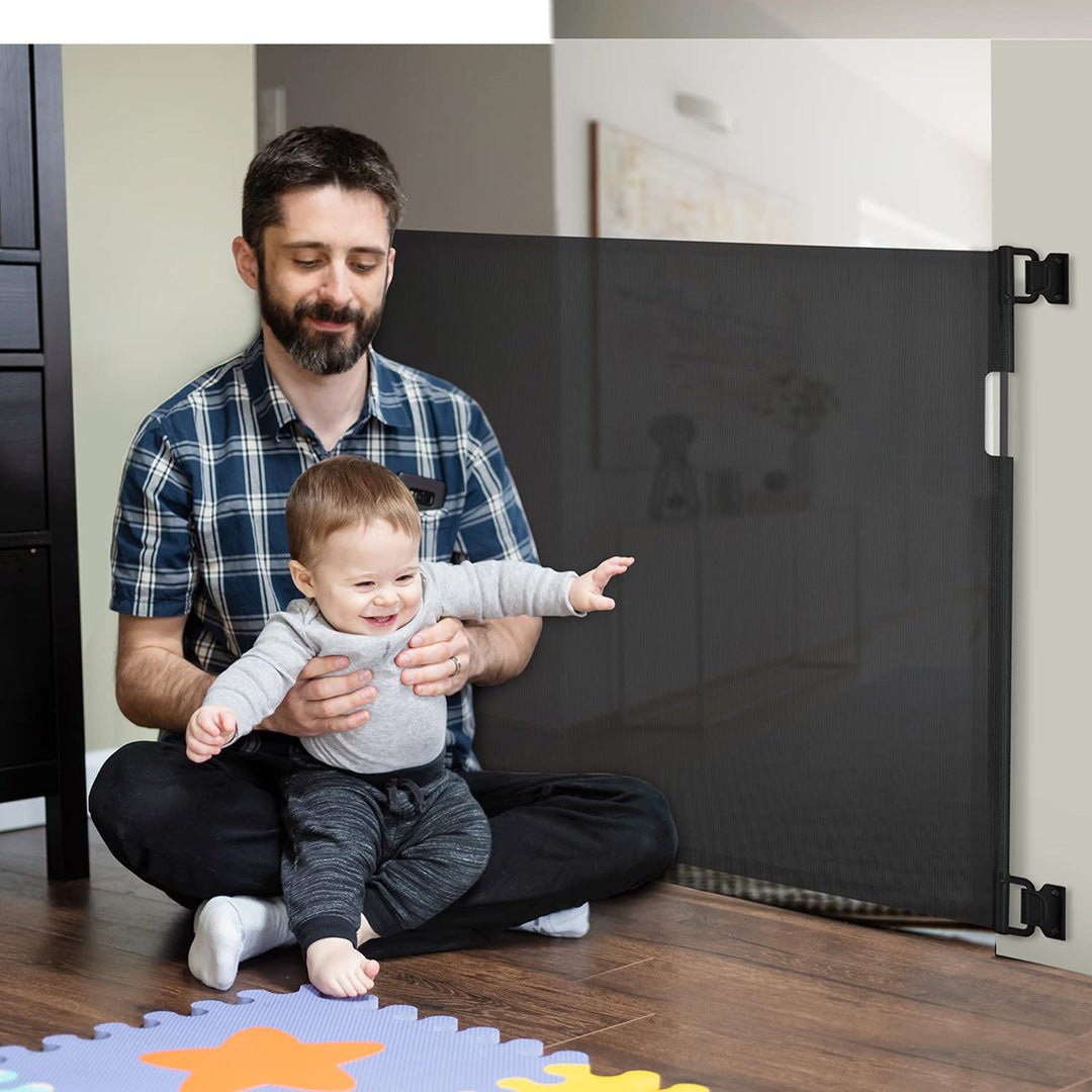 Puerta retráctil de seguridad para bebés Negro Momcozy
